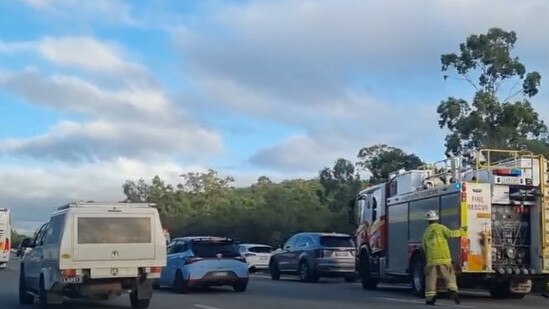 Emergency services at the scene of a crash on the M1 northbound in Pimpama