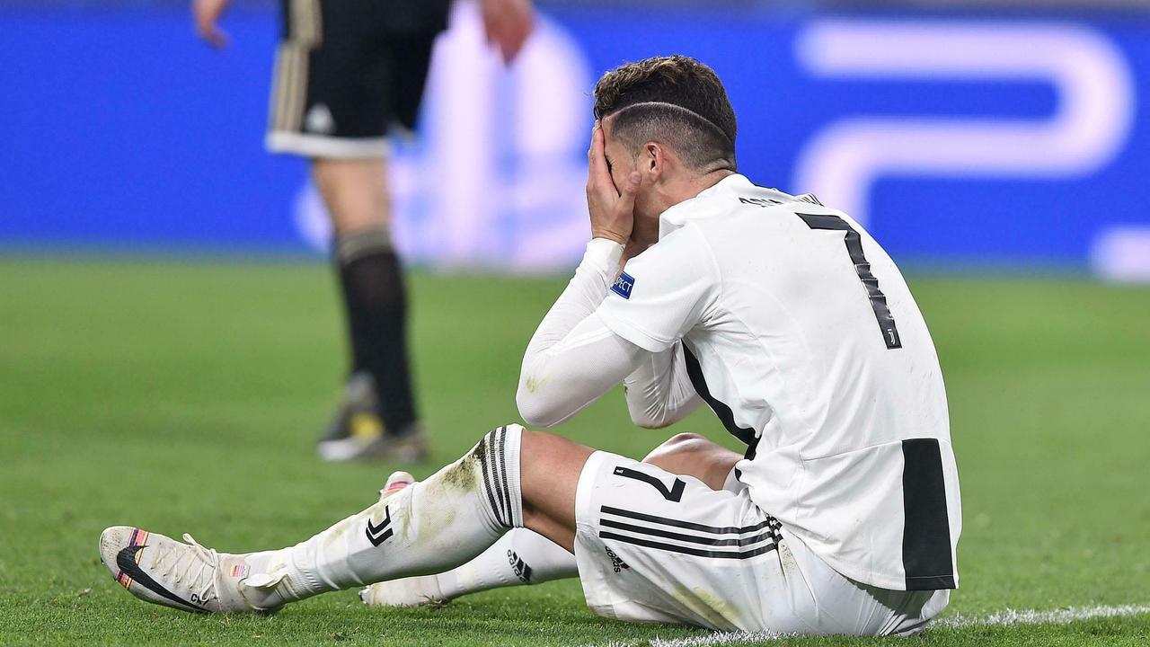 Juventus' Cristiano Ronaldo hangs his head in his hands after Juventus were dumped out of the Champions League.