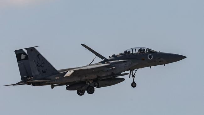 An Israeli fighter jet returning to base flies above an area near Tel Aviv. Picture: AFP