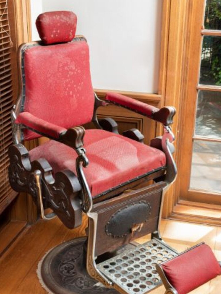 An antique barber’s chair is up for grabs. Picture: Gibson’s Auctioneers