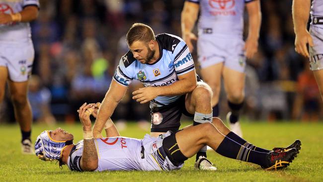 Wade Graham after tackling Johnathan Thurston during the Cronulla Sharks v North Queensland Cowboys match last night. Picture: Mark Evans