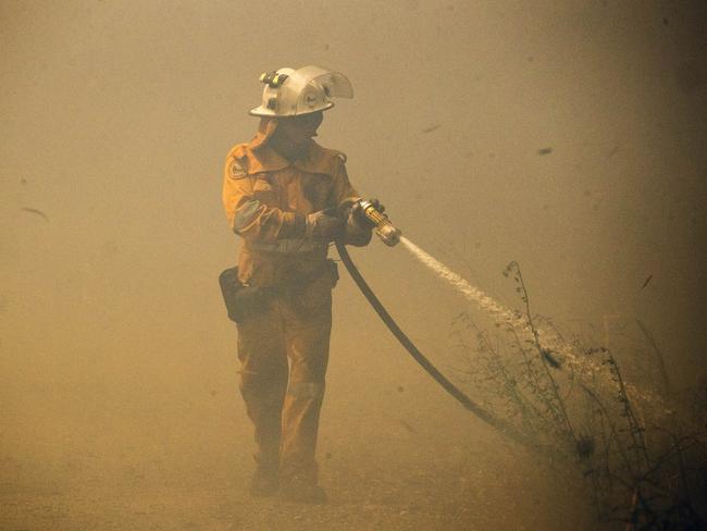 Fire crews battle bushfires at Little Mountain on the Sunshine Coast. Picture: Lachie Millard