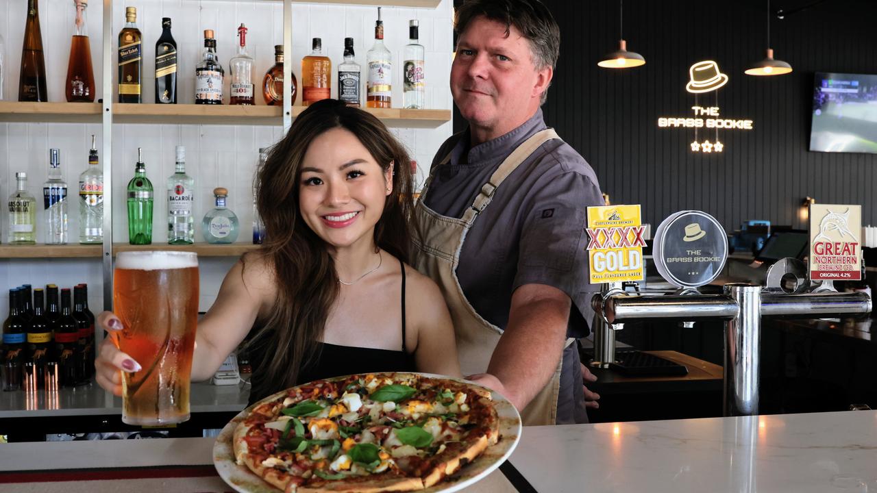 Cairns has a brand new sports bar, with the Brass Bookie opening in the old Outback Jack's building at the corner of Abbott and Aplin streets. Brass Bookie bartender Sinead Tan and head chef Shanon Burgoine are ready to pour plenty of Macalisters pints and serve gourmet pizzas at the bar's grand opening party this Saturday. Picture: Brendan Radke