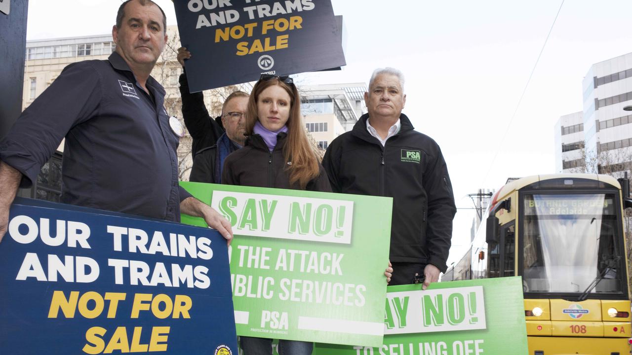 Rail, Tram and Bus Union branch secretary Darren Phillips with Natasha Brown and Nev Kitchin from the Public Service Association at an anti-privatisation protest in July. Picture: Emma Brasier