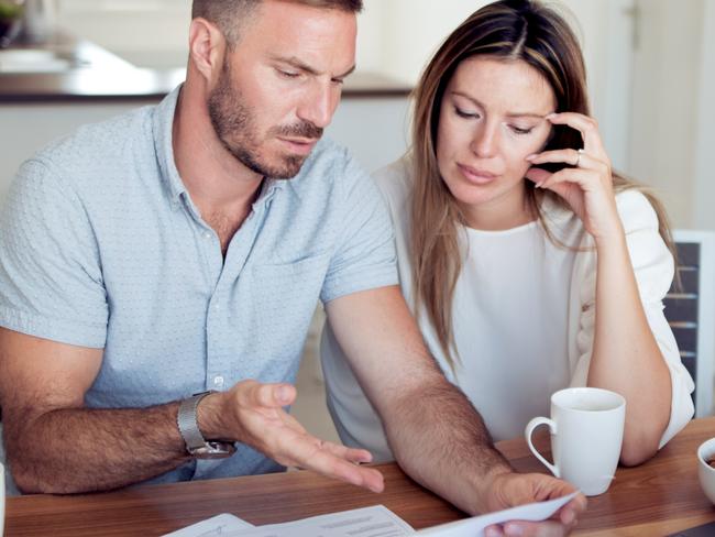 MONEY ISTOCK -  Young couple going through their financial records in their home. Picture: Istock