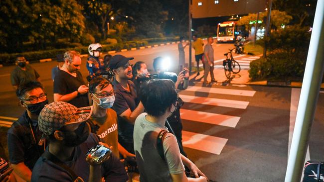 Media wait outside Singapore’s airport for the arrival of Sri Lanka's President Gotabaya Rajapaksa, his wife. Picture: AFP