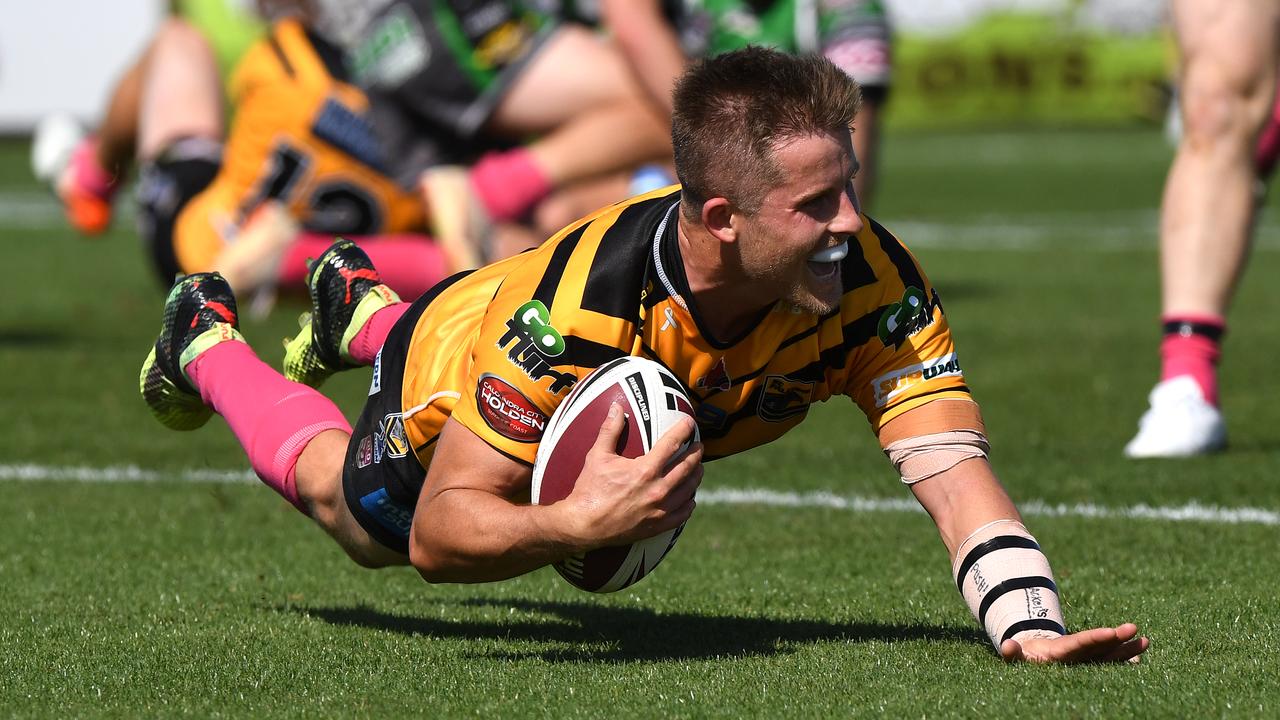 Sunshine Coast Falcons halfback Todd Murphy on his way to scoring a try against Townsville last weelend.