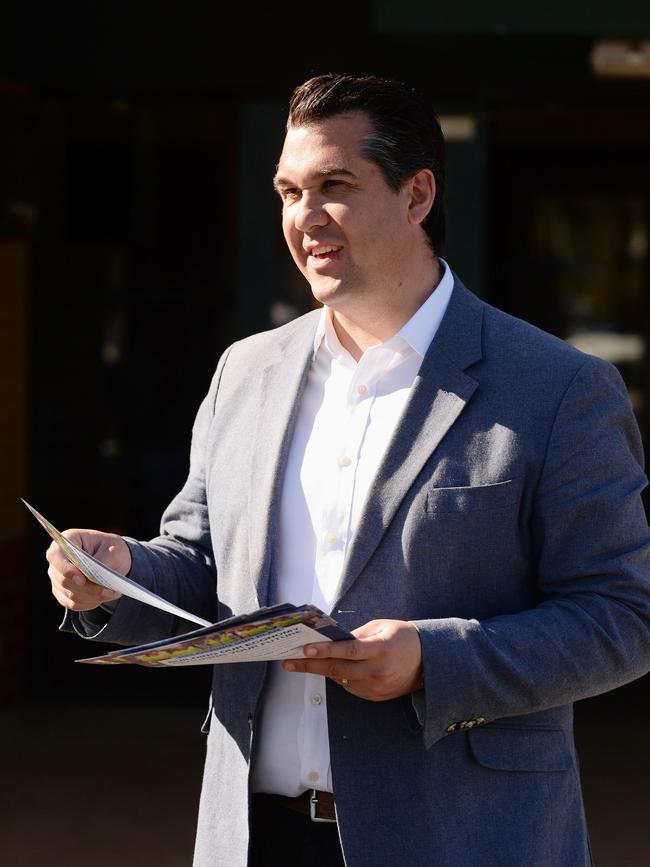 Federal member for Deakin Michael Sukkar handing out how to vote cards. Picture: Lawrence Pinder