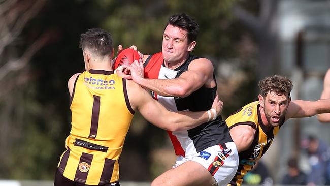 Myrtleford star Matthew Dussin crashes through Wang Rovers player Dylan Stone. Picture Yuri Kouzmin