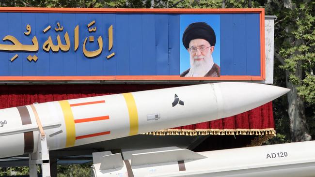 An Iranian military truck carries parts of a Sayad 4-B missile past a portrait of supreme leader Ayatollah Ali Khamenei during a military parade. Picture: Atta Kenare/AFP