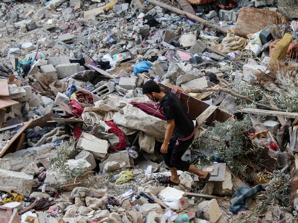 Palestinian citizens inspect damage caused by Israeli air strikes on their homes. Picture: AFP/Getty Images