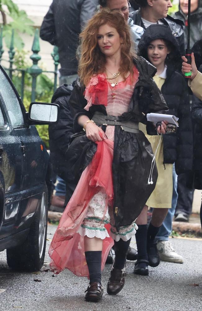 Isla Fisher immerses herself in character as she films a rainy day scene in London for Bridget Jones 4. Picture: BACKGRID