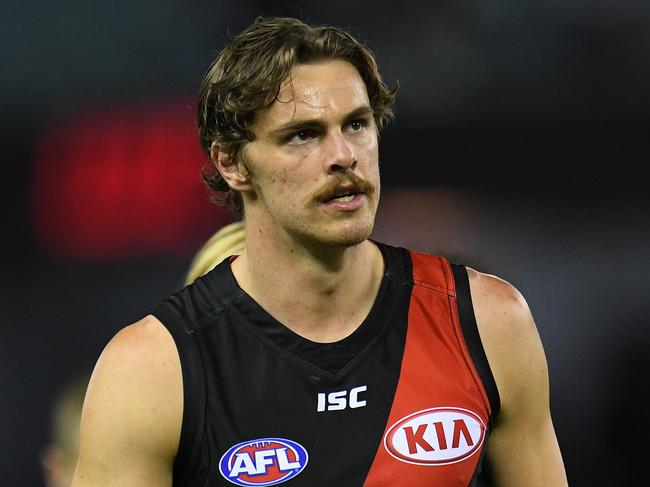 Joe Daniher of the Bombers leaves the ground after the Round 6 AFL match between the Essendon Bombers and the Melbourne Demons at Etihad Stadium in Melbourne, Sunday, April 30, 2017. (AAP Image/Julian Smith) NO ARCHIVING, EDITORIAL USE ONLY