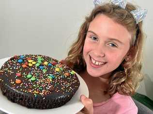 SWEET GESTURE: Gabby Desch, 9, bakes and delivers birthday cakes for kids less fortunate on the Coast. Picture: Patrick Woods