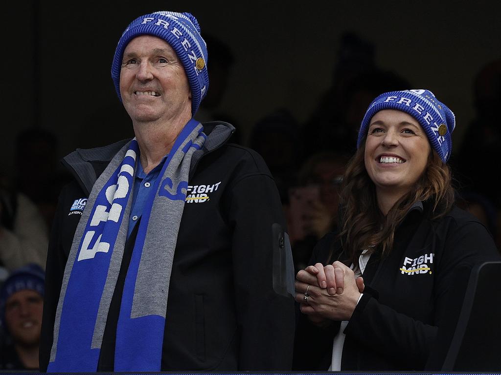 Neale Daniher and his daughter Bec at the top of the ice slide at the MCG to help raise awareness for the fight against MND. Pic: Michael Klein