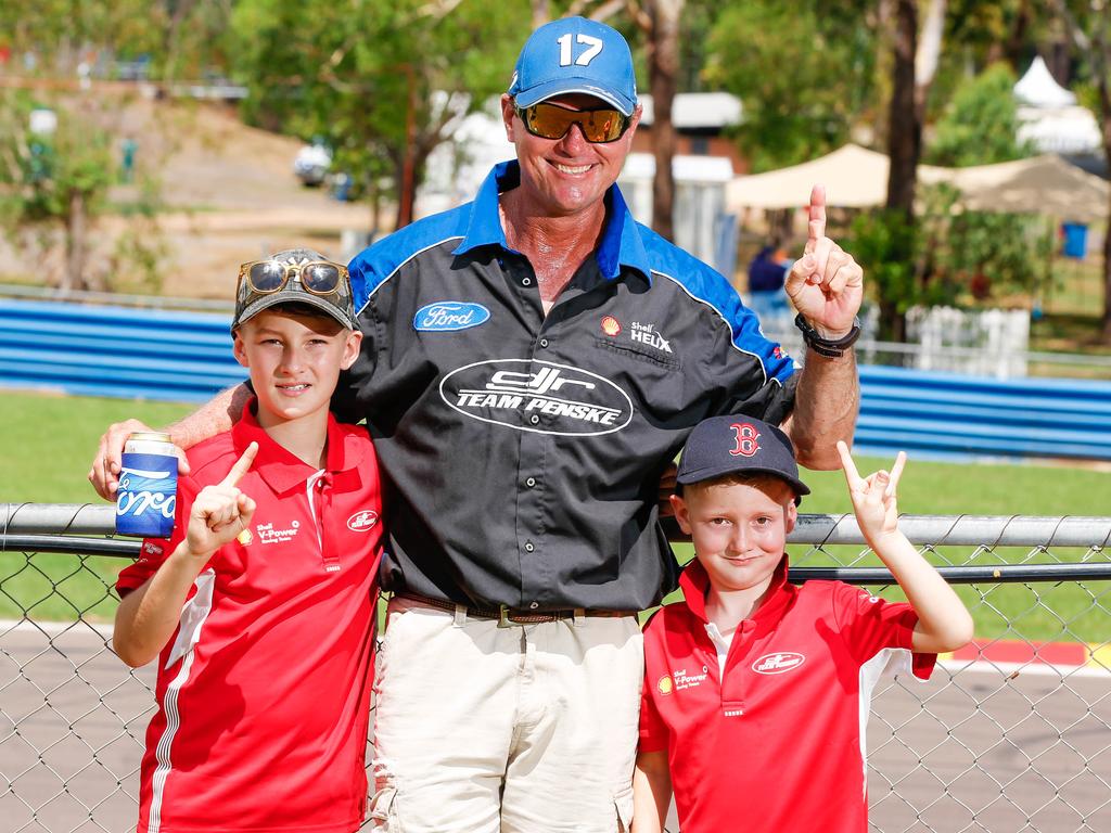 Wayne Stanley with his kids Dylan,10, and Brody, 7, at the Darwin Supercars at Hidden Valley. Picture: GLENN CAMPBELL