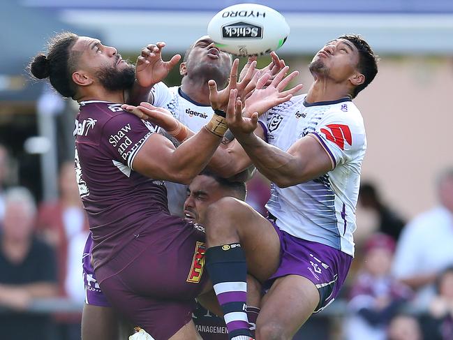 Manly’s Jorge Taufua of the Sea Eagles and Melbourne’s Marion Seve compete for a high ball. Picture: Getty Images