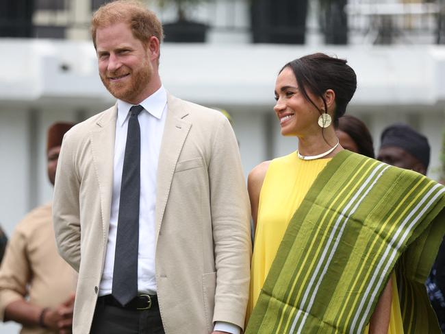 Britain's Prince Harry (2ndR), Duke of Sussex, and  Britain's Meghan (R), Duchess of Sussex, react as Lagos State Governor, Babajide Sanwo-Olu (unseen), gives a speech at the State Governor House in Lagos on May 12, 2024 as they visit Nigeria as part of celebrations of Invictus Games anniversary. (Photo by Kola SULAIMON / AFP)