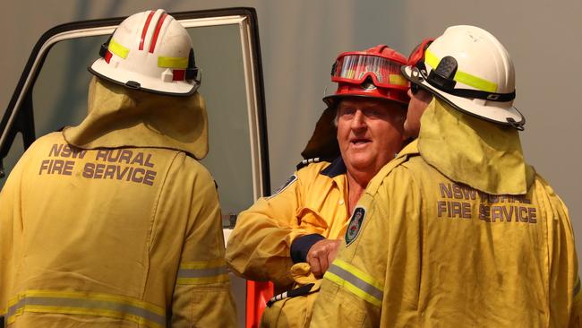 Firefighters battle bushfires in Busbys Flat in northern NSW. Picture: AAP/Jason O'Brien