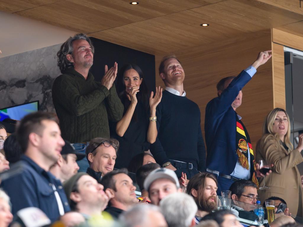 Harry and Meghan let loose at an NHL game in Vancouver, British Columbia, Canada. Picture: Getty Images