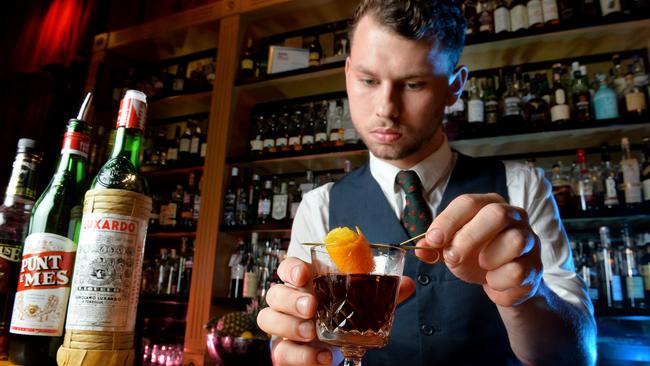 A bartender prepares a cocktail at 1806. Picture: Jay Town