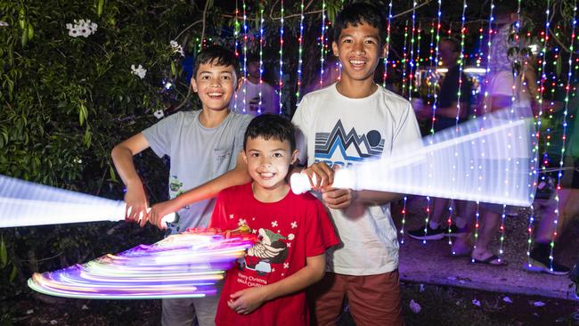 Brothers (from left) Cayden, Harry and Neoby Weber having fun with light toys at Toowoomba's Christmas Wonderland in Queens Park, Saturday, December 7, 2024. Picture: Kevin Farmer