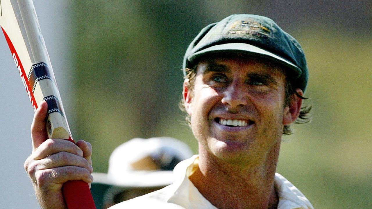 Matthew Hayden waves his bat as he leaves the field after scoring the then highest Test score of all time. 