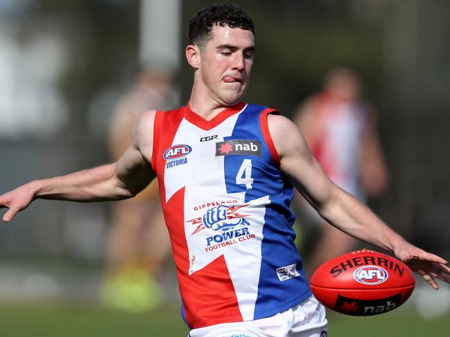 Sam Flanders takes a kick for Gippsland Power.