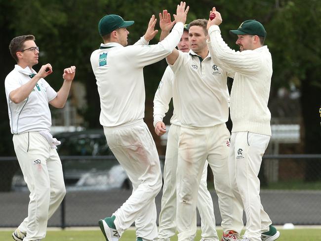 Rosanna players celebrate a wicket. Picture: Hamish Blair