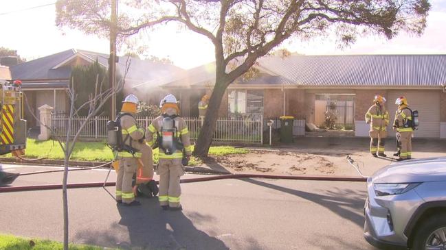 A woman has been rushed to hospital after a fire in Angle Park on Friday. Picture: 7NEWS