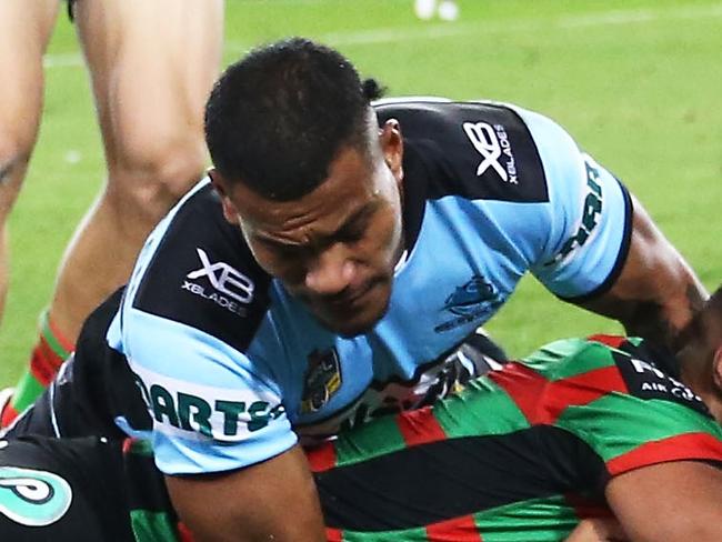 SYDNEY, AUSTRALIA - JUNE 01:  Robert Jennings of the Rabbitohs grounds the ball under pressure from Sione Katoa of the Sharks during the round 13 NRL match between the South Sydney Rabbitohs and the Cronulla Sharks at ANZ Stadium on June 1, 2018 in Sydney, Australia.  (Photo by Matt King/Getty Images)