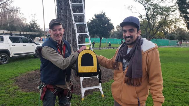 Smiling faces: Nigel Williamson — from Nigel’s Animal Rescue — with Kage the cat and his owner, Amit Vinod, 37, after the rescue. Picture: Paul Shapiro