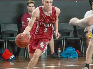 ON THE RUN: Bundaberg Bulls player Tyler Davis moves towards the basket. Picture: Brian Cassidy