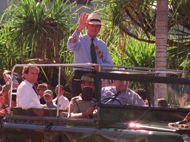 Duke of Edinburgh, Prince Philip waves to Darwin crowd lining street for annual Anzac Day march on April 25, 1998. Picture: NT NEWS