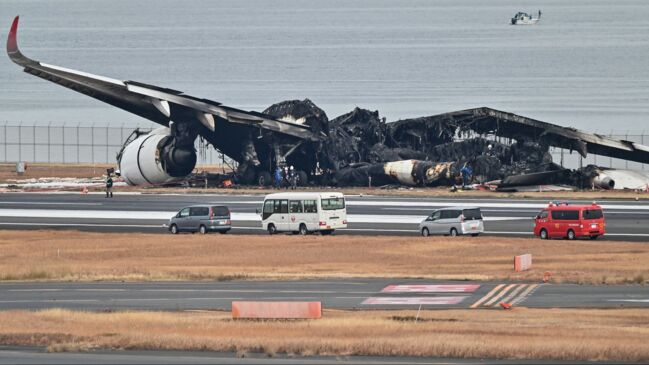 Watch: Wreckage of Japan Airlines Plane Inspected After Crash