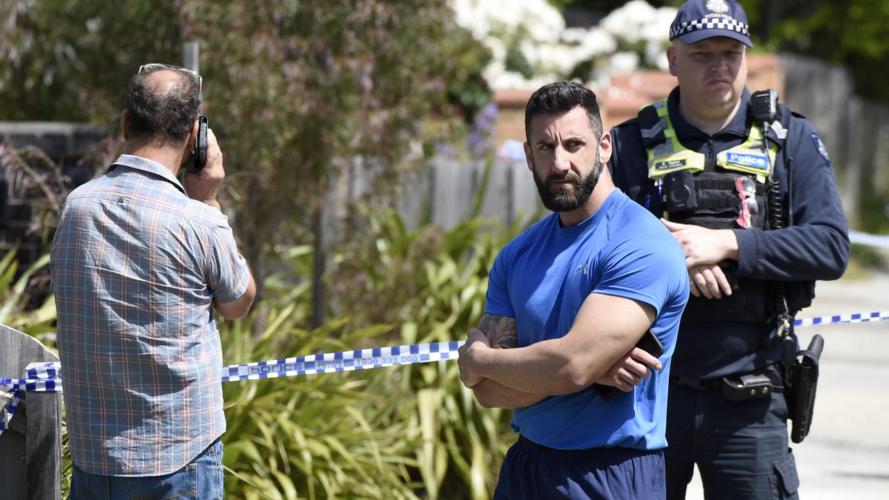 Edward Azzopardi (left) and his son at the scene on Reid Street in South Morang where his daughter Nikkita was discovered dead. Picture: NewsWire / Andrew Henshaw