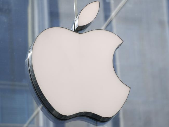 (FILES) This file photo shows a picture taken in center Milan on May 30, 2019 of the logo of American multinational company Apple. - Apple is making environmental and social values factors it will weigh when calculating bonuses for top executives, according to a regulatory filing on January 5. The change taking effect this year is intended to motivate Apple executives "to meet exceptionally high standards of values-driven leadership in addition to delivering strong financial results," the Silicon Valley technology titan said in proxy documents filed with the Securities and Exchange Commission. (Photo by Miguel MEDINA / AFP)