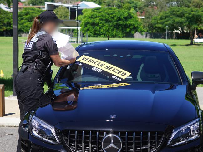 A SPER enforcement officer seizing a vehicle.