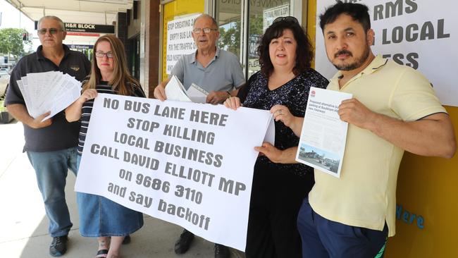 Business owners Joe Laviano, Loren Holmes, customer Anton Bognar, business owner Danielle Coronno and Mohammad Rezaee are angry being told a "peak hour" bus lane outside their shops on Old Northern Rd will be changed to a 24 hour bus lane. Picture: David Swift