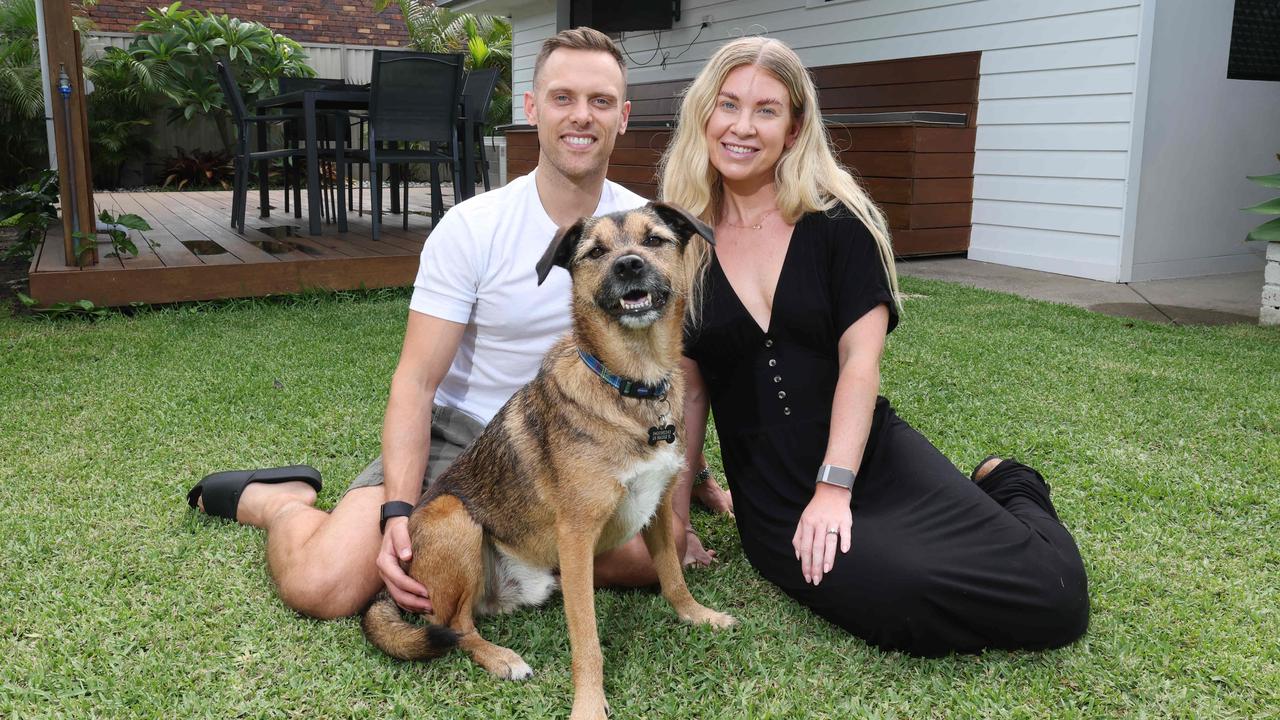 Ryan Davies and his wife Chloe Cowan, with their dog Hugo, have just moved to the Gold Coast from the UK. Picture: Glenn Hampson