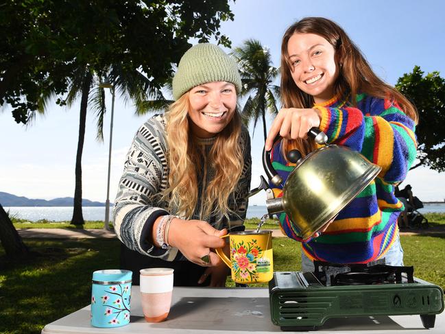 Alicia McGrade and Sarah Durrant, from Perth, warm up with a cuppa on the Strand. Picture: Shae Beplate.