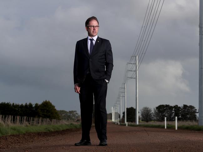 12/09/2018  Liberal MP Richard Riordan next to controversial power lines that run for 50km in the Mortlake area transmitting power from nearby wind farms.Picture : David Geraghty / The Australian.