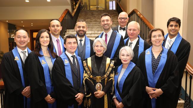 Adelaide City Councillors: Front, Simon Hou, Mary Couros, Alex Hyde, Lord Mayor Sandy Verschoor, Anne Moran, Helen Donovan. Back, Arman Abrahimzadeh, Housman Abiad, Robert Simms, Franz Knoll, Jessy Khera. Far back, Phillip Martin. Picture: AAP / Russell Millard