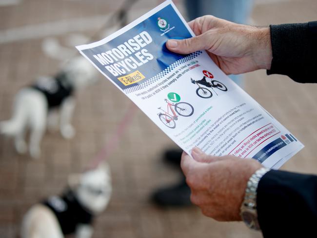 Police handed out information flyers to riders as part of the safety operation. Picture: NCA NewsWire / Nikki Short