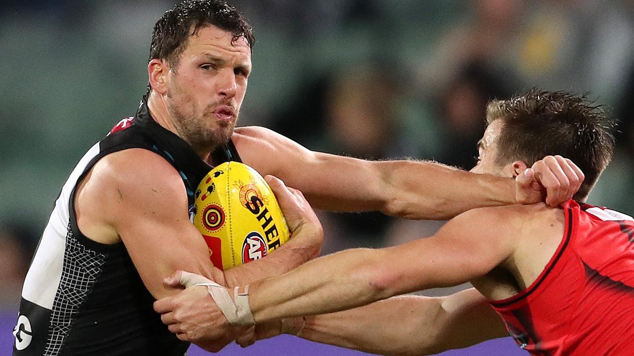 Travis Boak fends off Zach Merrett in the Power’s win over the Bombers. Picture: AFL Photos/Getty Images