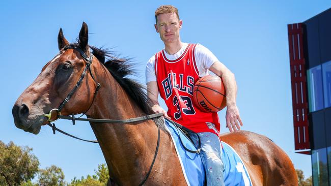 Jockey Mark Zahra wearing his Bulls jersey ahead of the trackside basketball court being built at on track at Caulfield Racecourse. Picture: Brendan Beckett