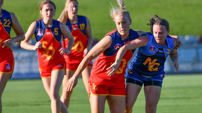 Bo Tankey (no. 5, left) says her first game of representative football has further fuelled her desire to play in the AFL’s women’s league. Picture: supplied