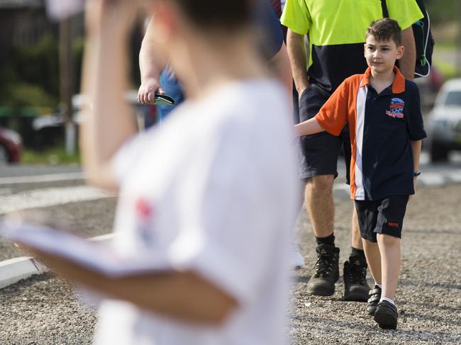 Joshua Adams, 8, walking to North Kellyville Public School. Picture: Dylan Robinson