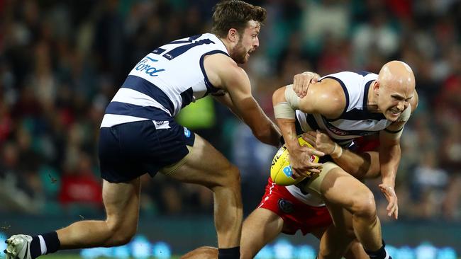 Gary Ablett of the Cats is tackled (Photo by Cameron Spencer/Getty Images)