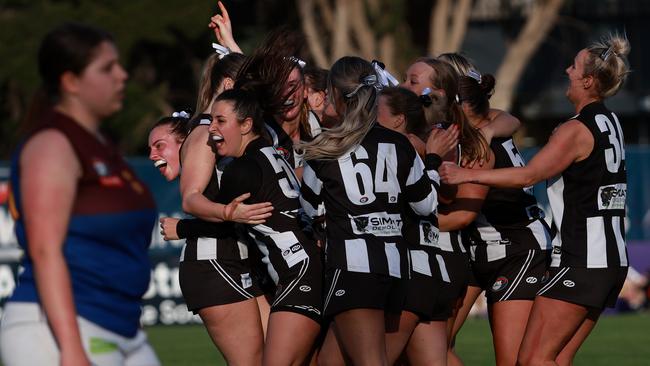 Montmorency players celebrate on the final siren. Picture: Hamish Blair